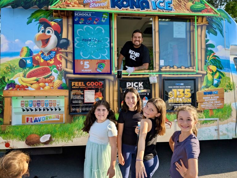 Owner of Kona Ice of Marin with children waiting to order from Kona Ice Truck
